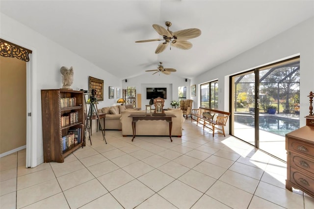 tiled living room with ceiling fan and lofted ceiling