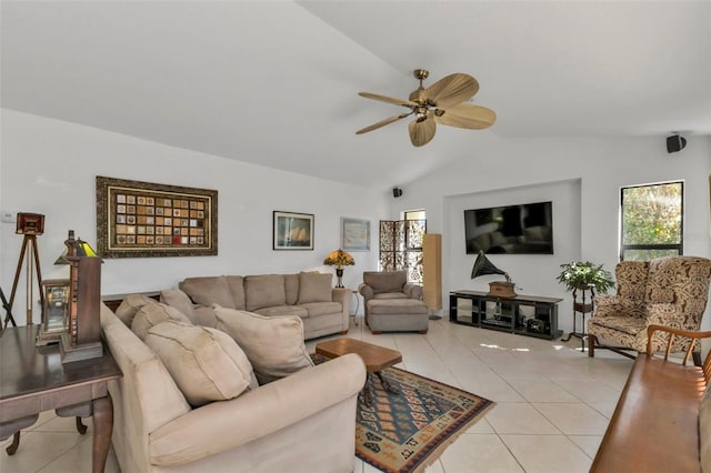 tiled living room with ceiling fan and lofted ceiling