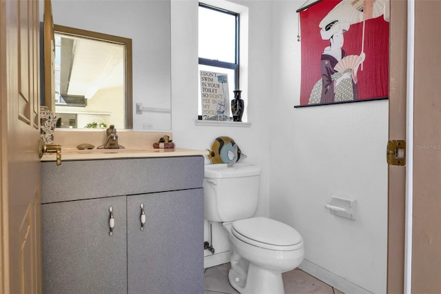 bathroom featuring toilet and vanity