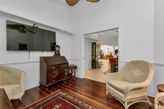 living area with ceiling fan and hardwood / wood-style floors