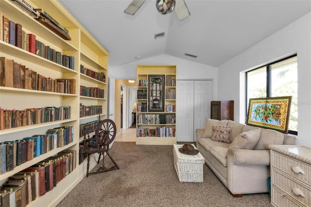 sitting room with light carpet, ceiling fan, and vaulted ceiling