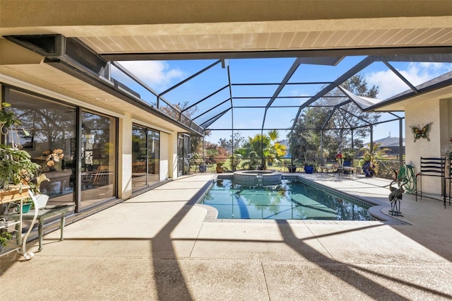 view of pool featuring a lanai, an in ground hot tub, and a patio