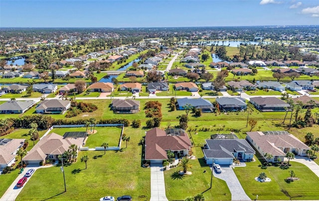 bird's eye view with a water view