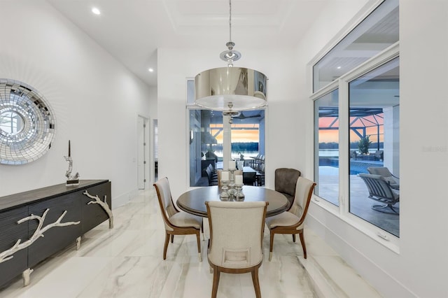 dining area featuring a tray ceiling