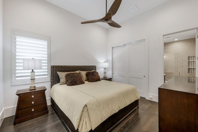 bedroom featuring ceiling fan, a closet, and dark wood-type flooring