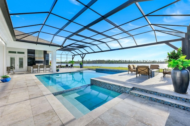 view of swimming pool featuring an in ground hot tub, a patio, a water view, and glass enclosure