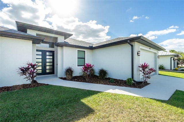 exterior space with a front lawn and a garage