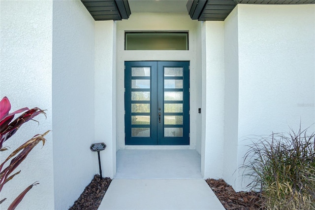 property entrance featuring french doors