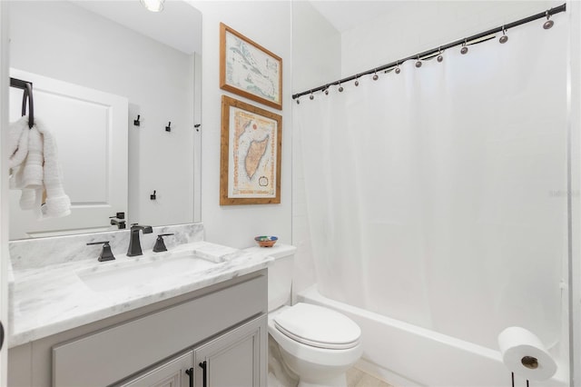 full bathroom with vanity, shower / bath combination with curtain, and toilet