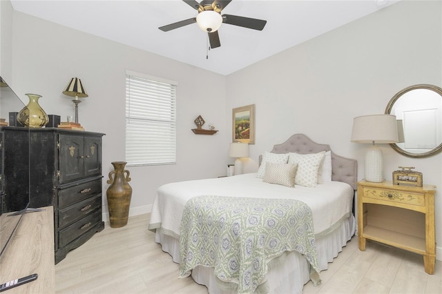 bedroom with ceiling fan and light hardwood / wood-style flooring