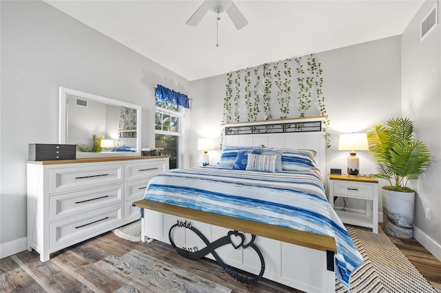 bedroom featuring ceiling fan and dark hardwood / wood-style flooring