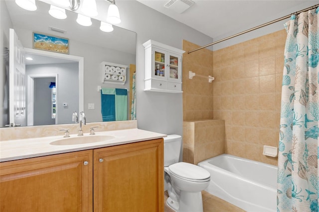 full bathroom with shower / tub combo with curtain, vanity, and toilet