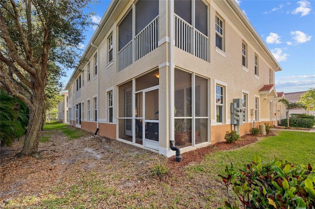 view of property exterior with a yard