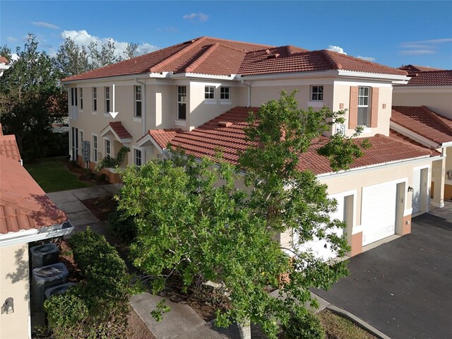 view of side of home featuring a garage