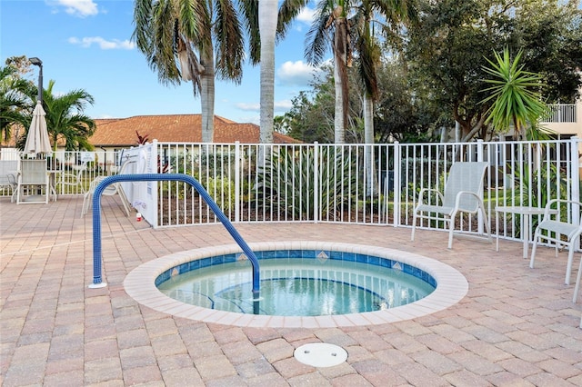 view of pool with a patio area and a community hot tub