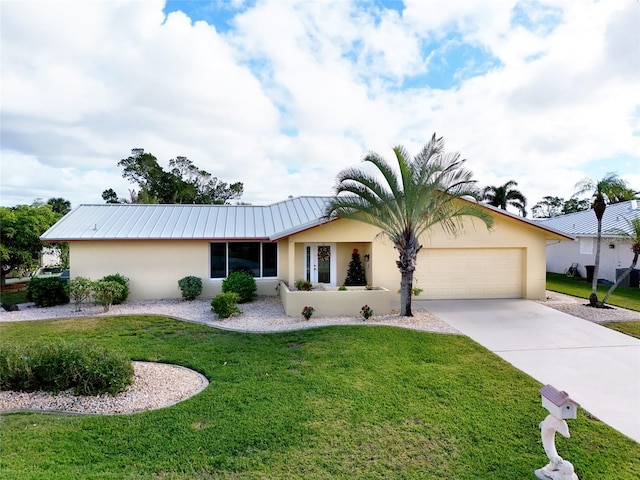 ranch-style home with a front lawn and a garage