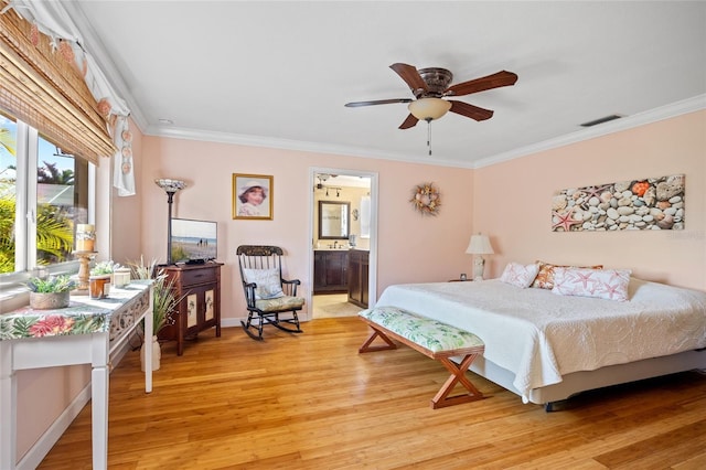 bedroom with ensuite bathroom, crown molding, ceiling fan, and light hardwood / wood-style floors