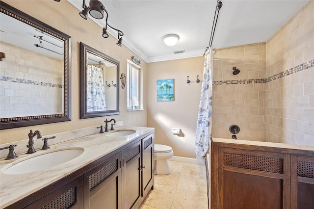 bathroom featuring ornamental molding, a shower with curtain, vanity, tile patterned flooring, and toilet