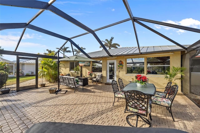 view of patio with outdoor lounge area and a lanai