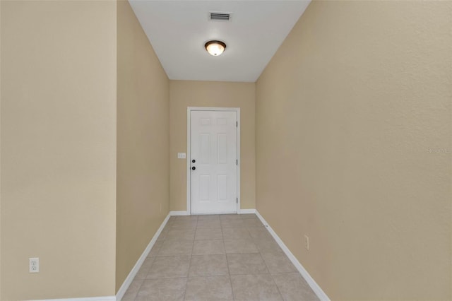 doorway featuring light tile patterned floors