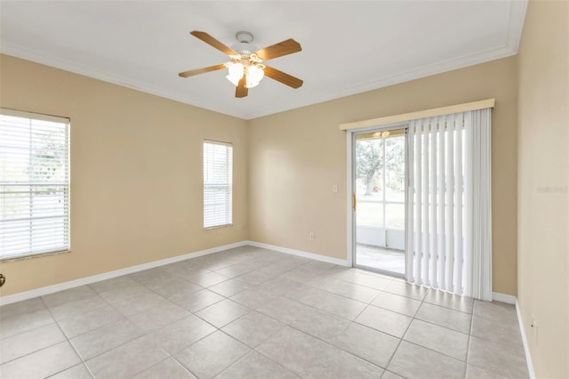 unfurnished room featuring plenty of natural light, ceiling fan, light tile patterned floors, and crown molding