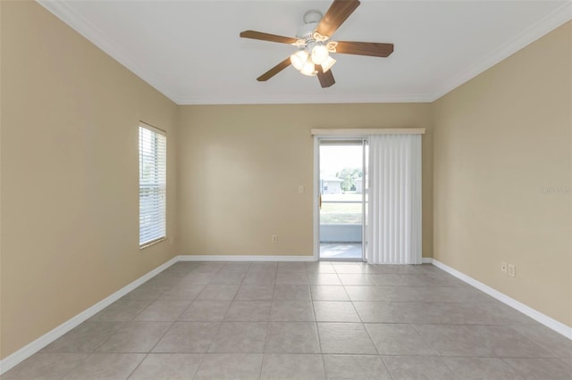 tiled empty room with plenty of natural light, ornamental molding, and ceiling fan