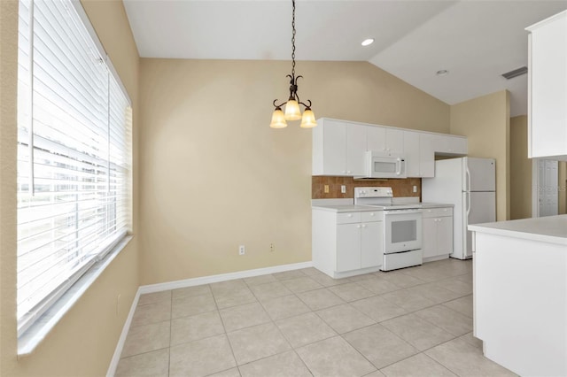 kitchen featuring a notable chandelier, vaulted ceiling, decorative light fixtures, white appliances, and white cabinets