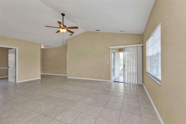 tiled spare room featuring ceiling fan and lofted ceiling