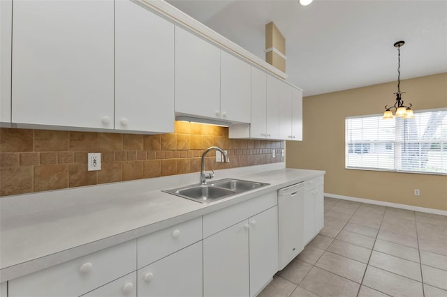 kitchen with dishwasher, white cabinets, sink, decorative backsplash, and light tile patterned floors