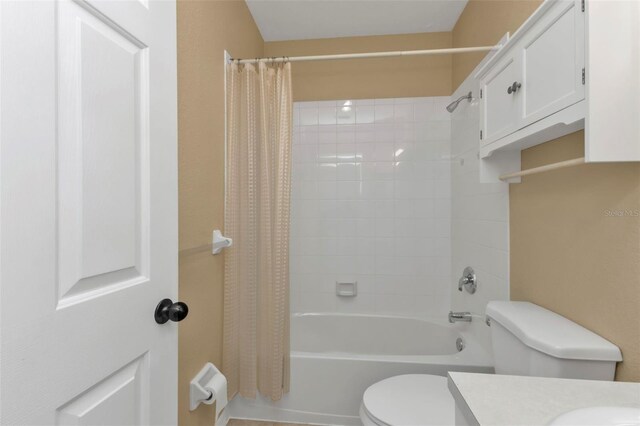 bathroom with toilet and shower / bathtub combination with curtain