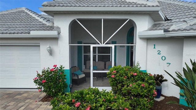 view of exterior entry featuring a garage