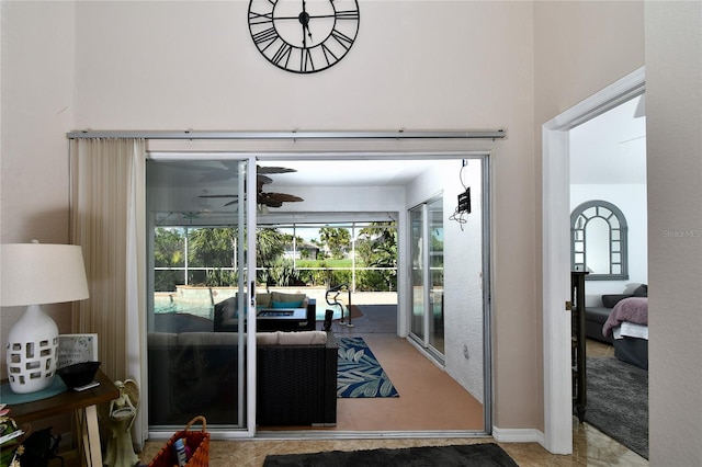 doorway to outside with ceiling fan