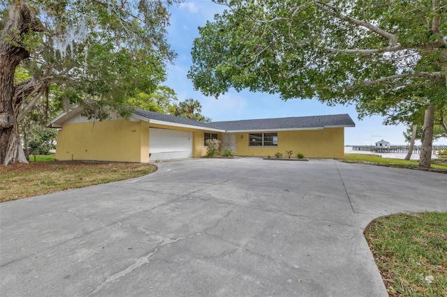 ranch-style home featuring a garage