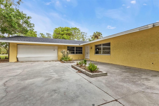 ranch-style house featuring a garage