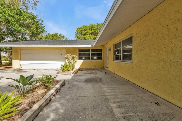 exterior space with a garage