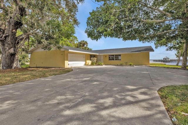 ranch-style home with a garage