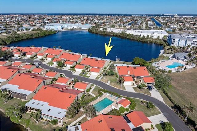 birds eye view of property with a water view