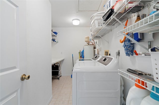 laundry room featuring separate washer and dryer, water heater, and light tile patterned flooring