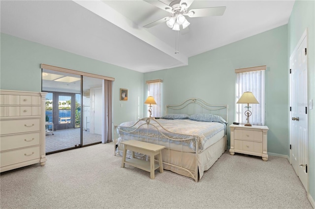 carpeted bedroom featuring french doors, access to outside, and ceiling fan