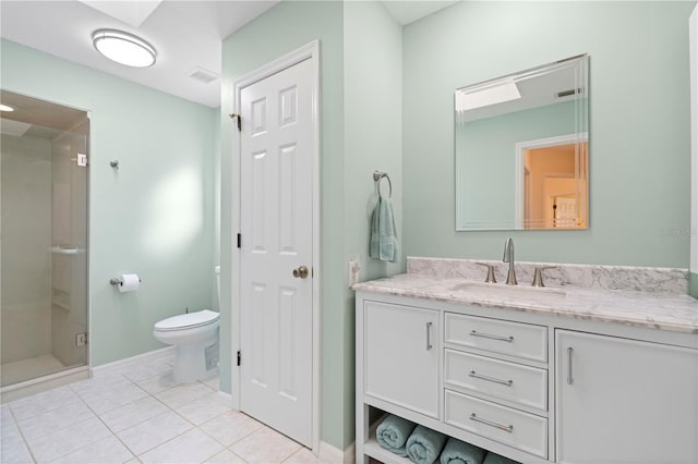 bathroom featuring toilet, vanity, tile patterned floors, and an enclosed shower