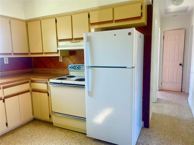 kitchen featuring white appliances and cream cabinets