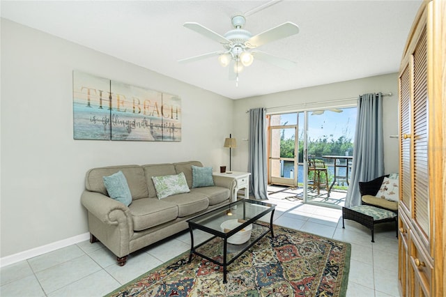 living room with ceiling fan and light tile patterned floors