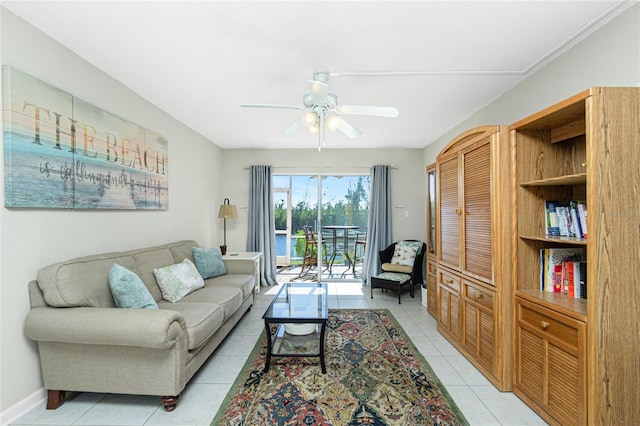 living room with light tile patterned floors and ceiling fan