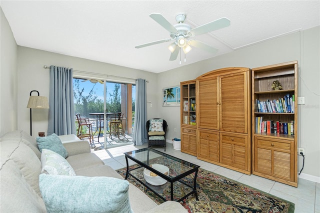 tiled living room featuring ceiling fan and a textured ceiling