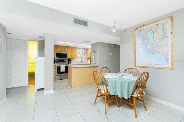 dining room featuring light tile patterned floors