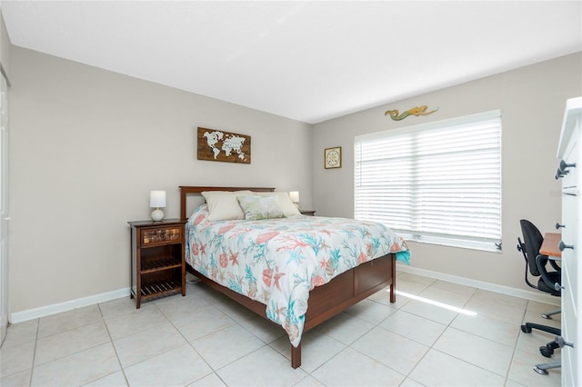 bedroom with light tile patterned flooring