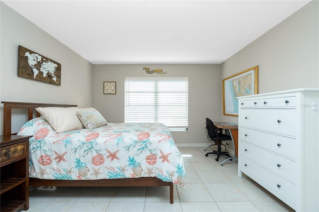 bedroom with light tile patterned floors