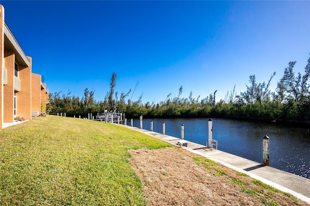 exterior space with a lawn and a water view