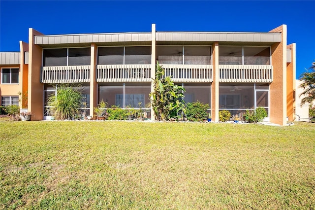 back of house with a yard