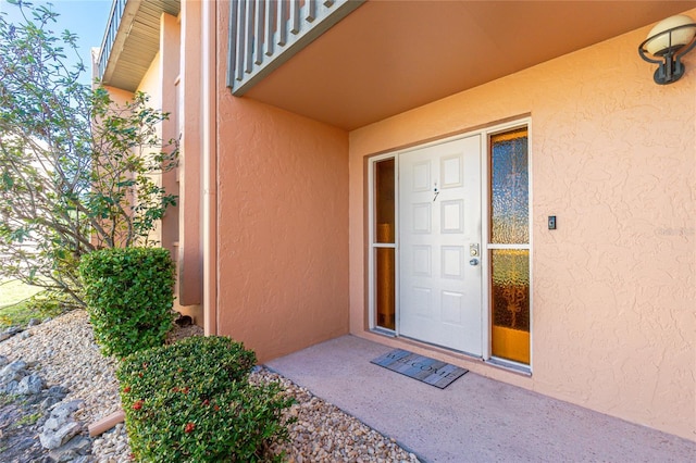 property entrance with a balcony